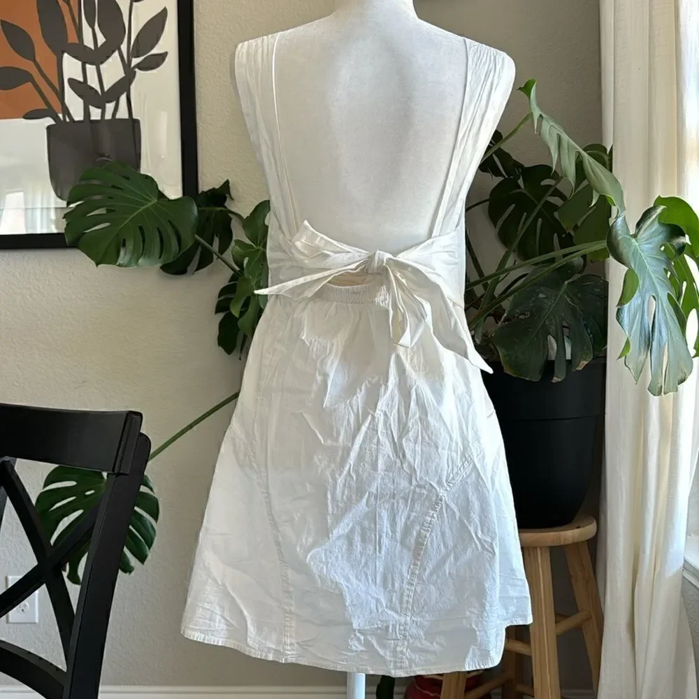 NWOT Free People Eye Catching Mini Dress Sleeveless Open Back Bow V Neck L